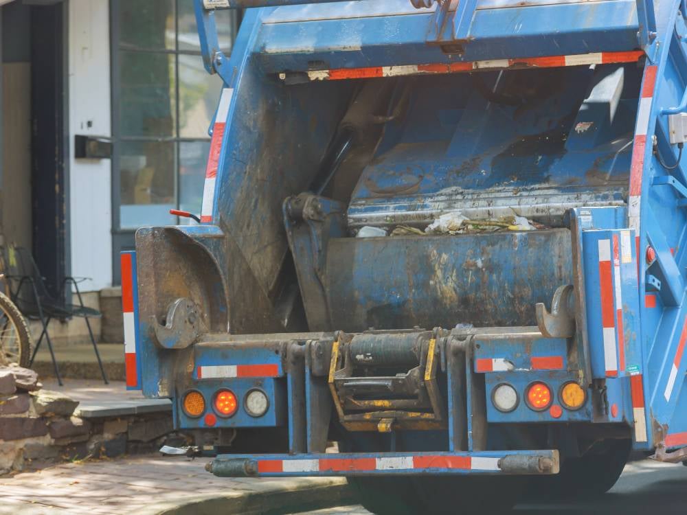 Certified Mechanics Working on Bin Lifter