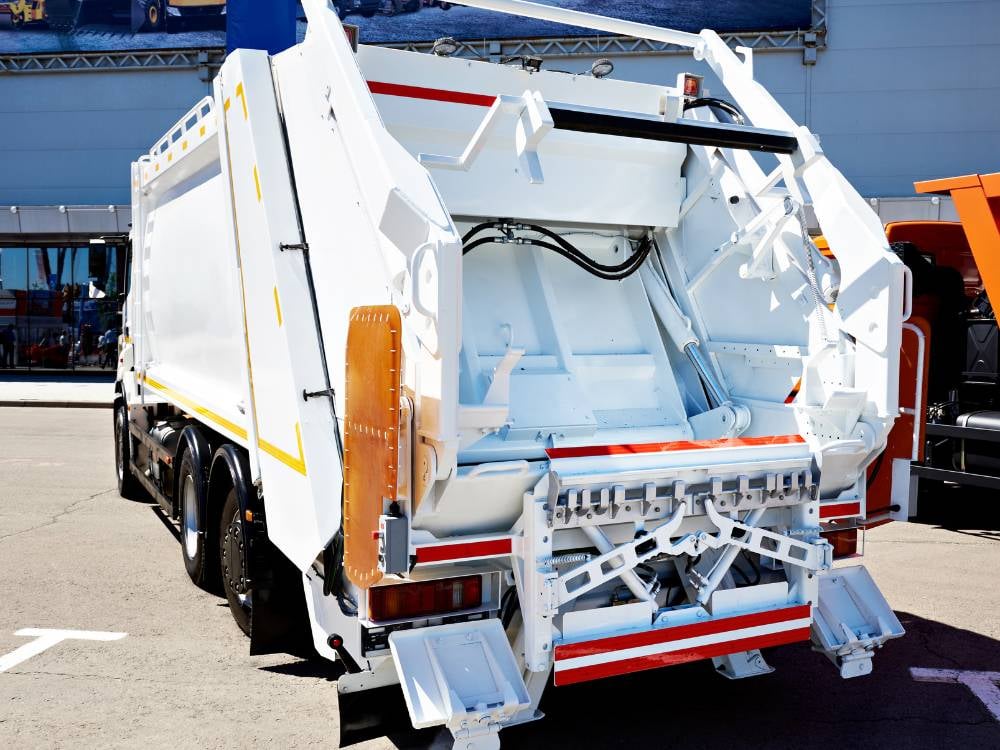 Team of Refuse Body Doctors working on waste compactor repair